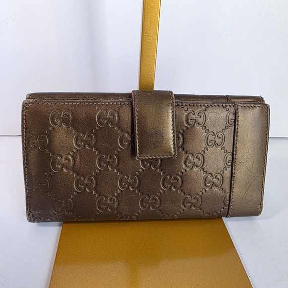 Gucci Handbags - Gucci Embossed Brown Leather Wallet
